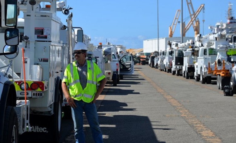 worker by trucks