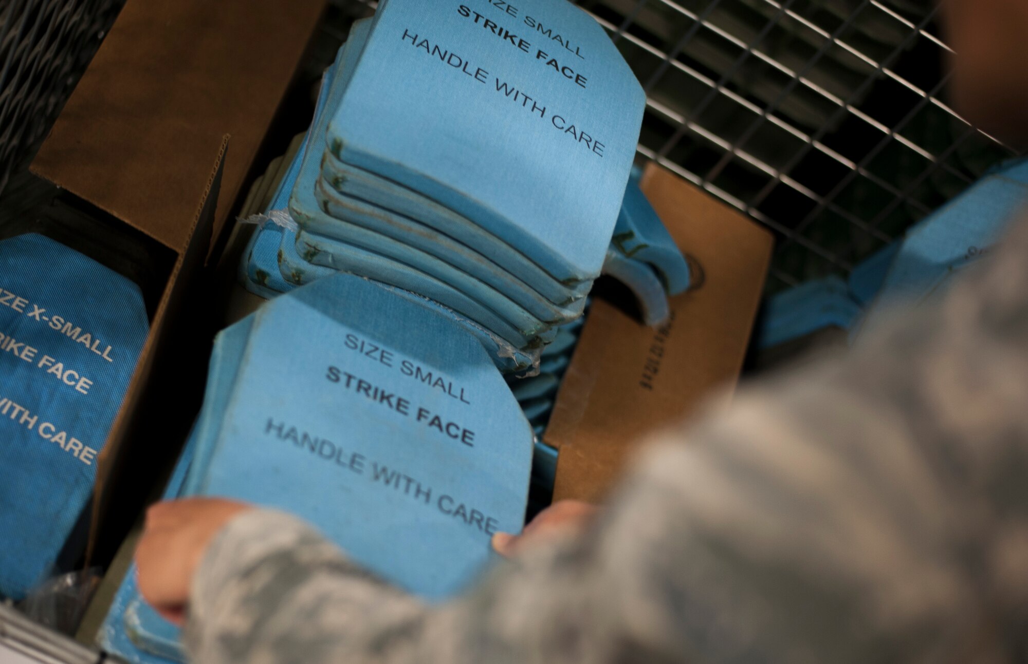U.S. Air Force Airman 1st Class Gantuya Larkins, an individual protective equipment (IPE) technician assigned to the 6th Logistics Readiness Squadron, performs an inventory check on vest plates at MacDill Air Force Base, Fla., Dec. 28, 2017.