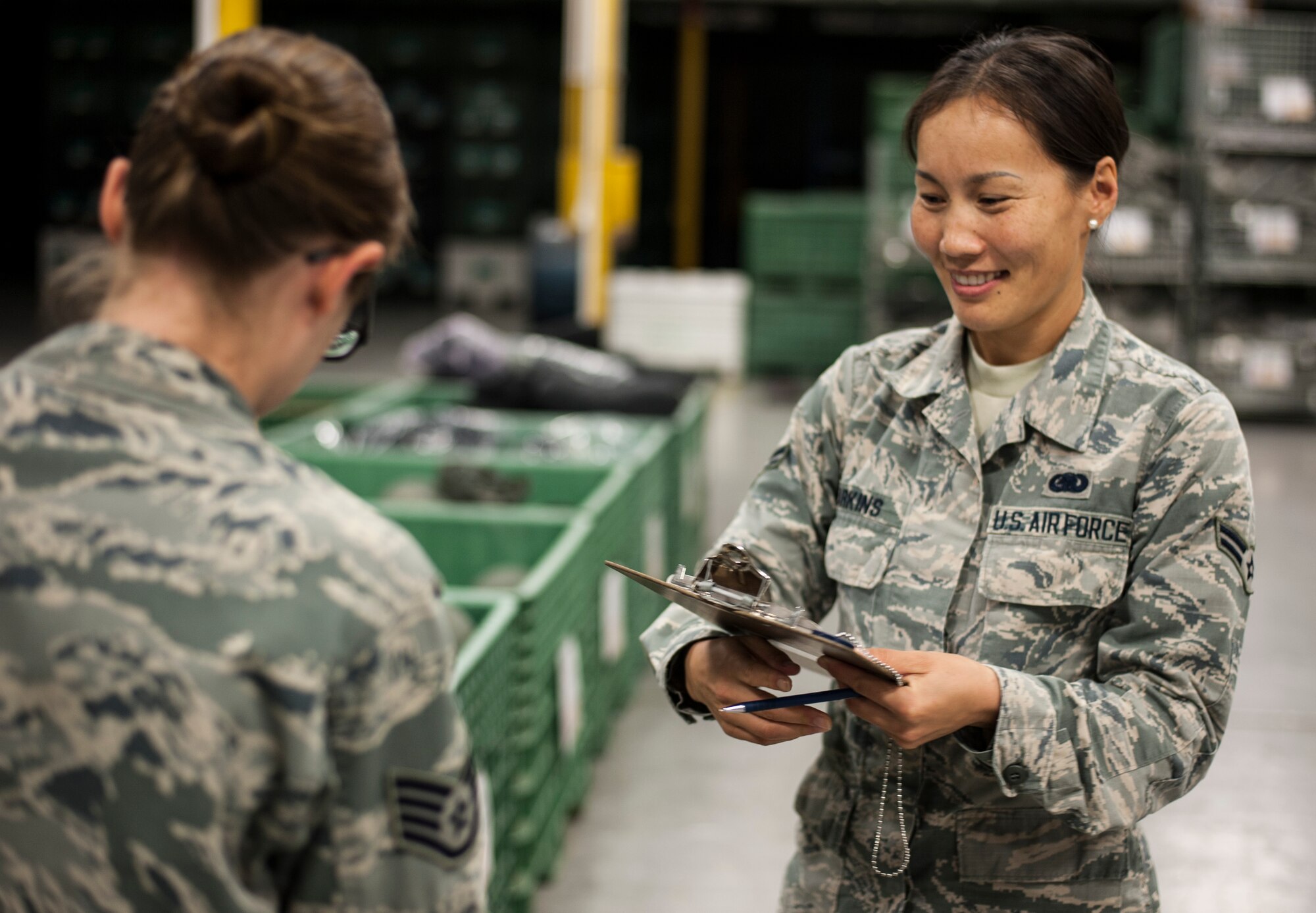 U.S. Air Force Airman 1st Class Gantuya Larkins, right, an individual protective equipment (IPE) technician assigned to the 6th Logistics Readiness Squadron, assists a customer make a deployment bag at MacDill Air Force Base, Fla., Dec. 28, 2017.