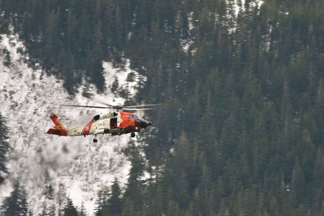 Image of Coast Guard helicopter performing search mission in Alaska