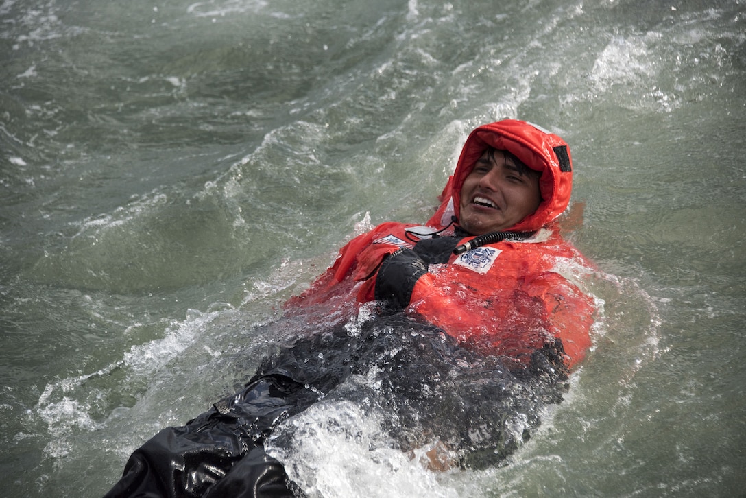 Image of Coast Guard member performing survival swim training.