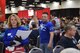 Senior Airman Leslie Ybarra, 433 Aerospace Medicine,  Squadron, medical technician carries a tray of plates to guests at the H-E-B’s 25th Annual Feast of Sharing on Dec. 23, 2017, at the Henry B. Gonzalez Convention Center in San Antonio, Texas. Ybarra was among 40 Alamo Wing members, friends and family, who helped the afternoon shift of volunteers serve up dinners at the Henry B. Gonzalez Convention Center in San Antonio, Texas. (U.S. Air Force photo by Tech. Sgt. Carlos J. Treviño)