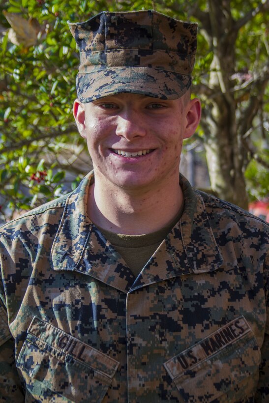 Marine Pfc. Austin D. Gill, a native of Tyronza, Arkansas, and graduate of East Poinsett County High School, poses for a photo outside of the John Wesley Marsh Center, where he works, aboard Marine Corps Base Quantico, Virginia, Nov. 29, 2017. Gill applies his self-motivation to work every day in the United States Marine Corps, constantly looking to better himself and build his strength. Gill is an administrative specialist and waivers clerk for the Marine Corps Recruiting Command. "I just like to sweat and challenge myself to push for greatness," Gill said. (Marine Corps photo by Pfc. Naomi Marcom)