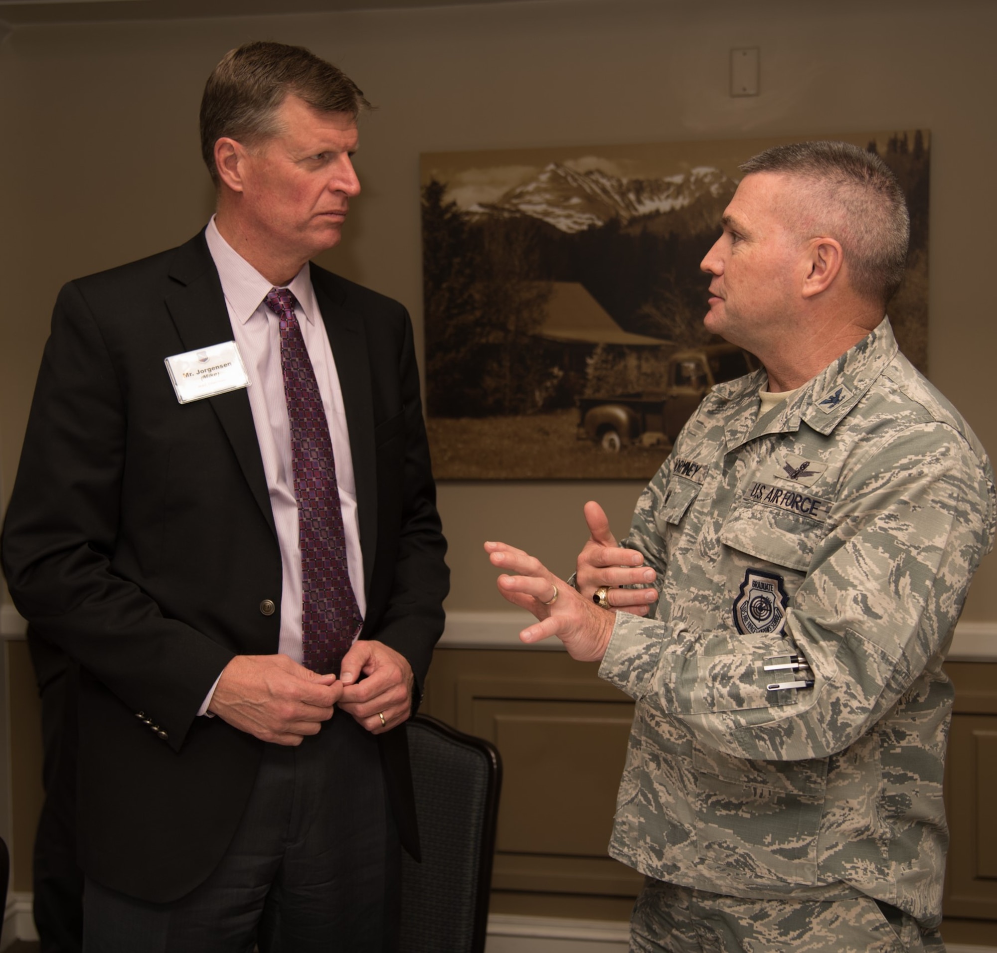 Colonel Eric Dorminey, 21st Space Wing vice commander, meets with Mike Jorgensen, a civilian member of the Area Chiefs of Staff, on Peterson AFB, Colorado Dec. 20 2017. The members of ACOS meet monthly to discuss relevant developments in the local area. (U.S. Air Force photo by 2nd Lt. Justin Davidson-Beebe)
