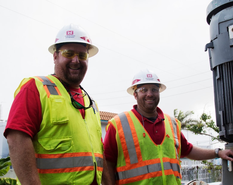 :  Neil Medlin (left), from the U.S. Army Corps of Engineers Savannah District, and Mike Bauman, from the Honolulu District, serve as Quality Assurance technicians for the Non-Federal Generator Operation and Maintenance mission in Puerto Rico. The mission helps repair existing generators in Puerto Rico to free up temporary emergency generators for use at additional sites. Here, Medlin and Bauman visit a flood control pump site near San Juan Dec. 27.