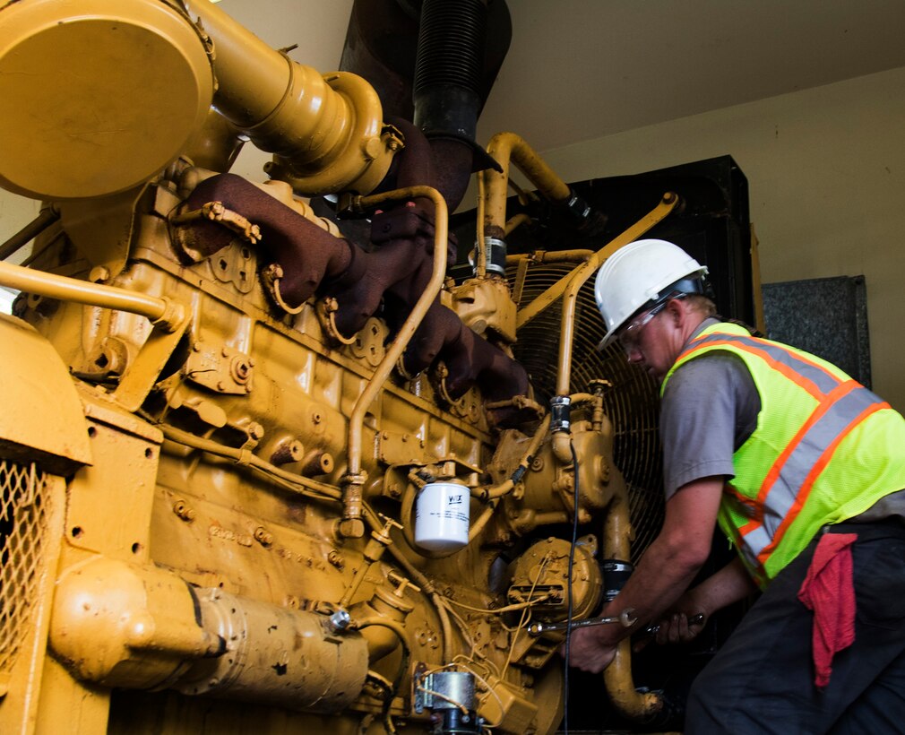 Cody Mercer, a government contractor mechanic, works on repairing a generator that powers a flood control pump near San Juan, Puerto Rico Dec. 27. The repairs are part of the U.S. Army Corps of Engineers' Non-Federal Generator Operation and Maintenance mission in support of FEMA's Hurricane Maria recovery efforts.