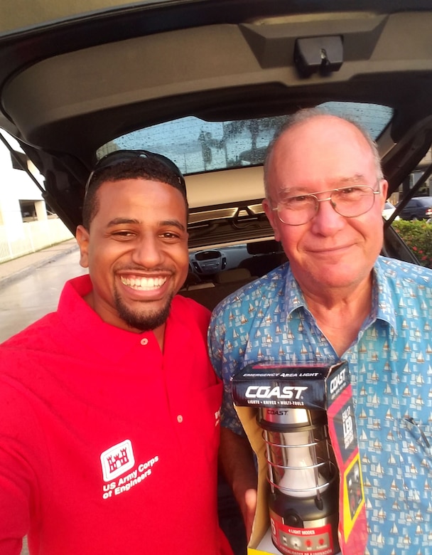 Neriah Holly, left, an architect with the U.S. Army Engineering and Support Center, Huntsville, takes a photo with Alberto Marquez, father of fellow Huntsville Center employee Maria Brito, while deployed to Puerto Rico Nov. 11, 2017. Brito serves as a secretary in Resource Management and coordinated with Holly to hand off some supplies to Marquez during Holly’s monthlong deployment.