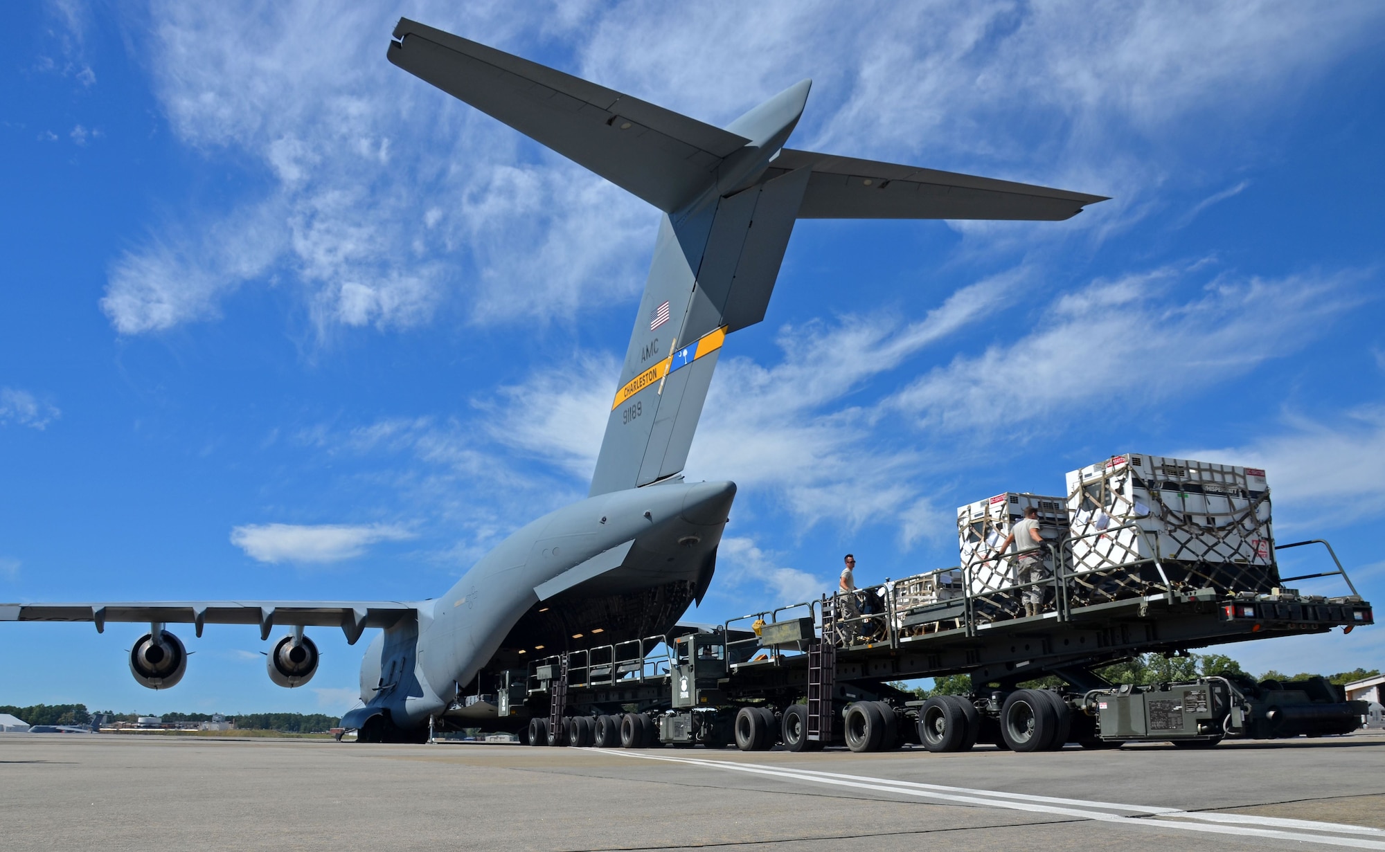 Reserve Citizen Airmen of the 94th Airlift Wing and other Air Force Reserve units load generators onto a C-17 Globemaster III at Dobbins Air Reserve Base, Ga., Oct. 1, 2017. Air Force and FEMA contracted aircraft arrived at Dobbins to pick up medical equipment and relief supplies, to include communication assets. (U.S. Air Force photo by TSgt. Kelly Goonan)