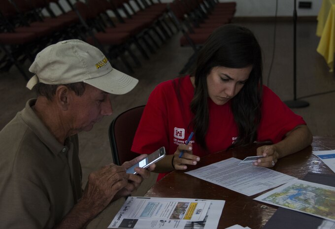 man and woman discuss right of entry process for operation blue roof