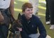 Frida, 56th Security Forces Squadron military working dog, poses for photos with All American Golf Tournament players during a tour of the kennels at Luke Air Force Base, Ariz., Dec. 27, 2017. The players were able to see the kennels, air traffic control tower, F-16 Fighting Falcon maintenance, and the explosive ordnance disposal unit. (U.S. Air Force photo by Senior Airman James Hensley)