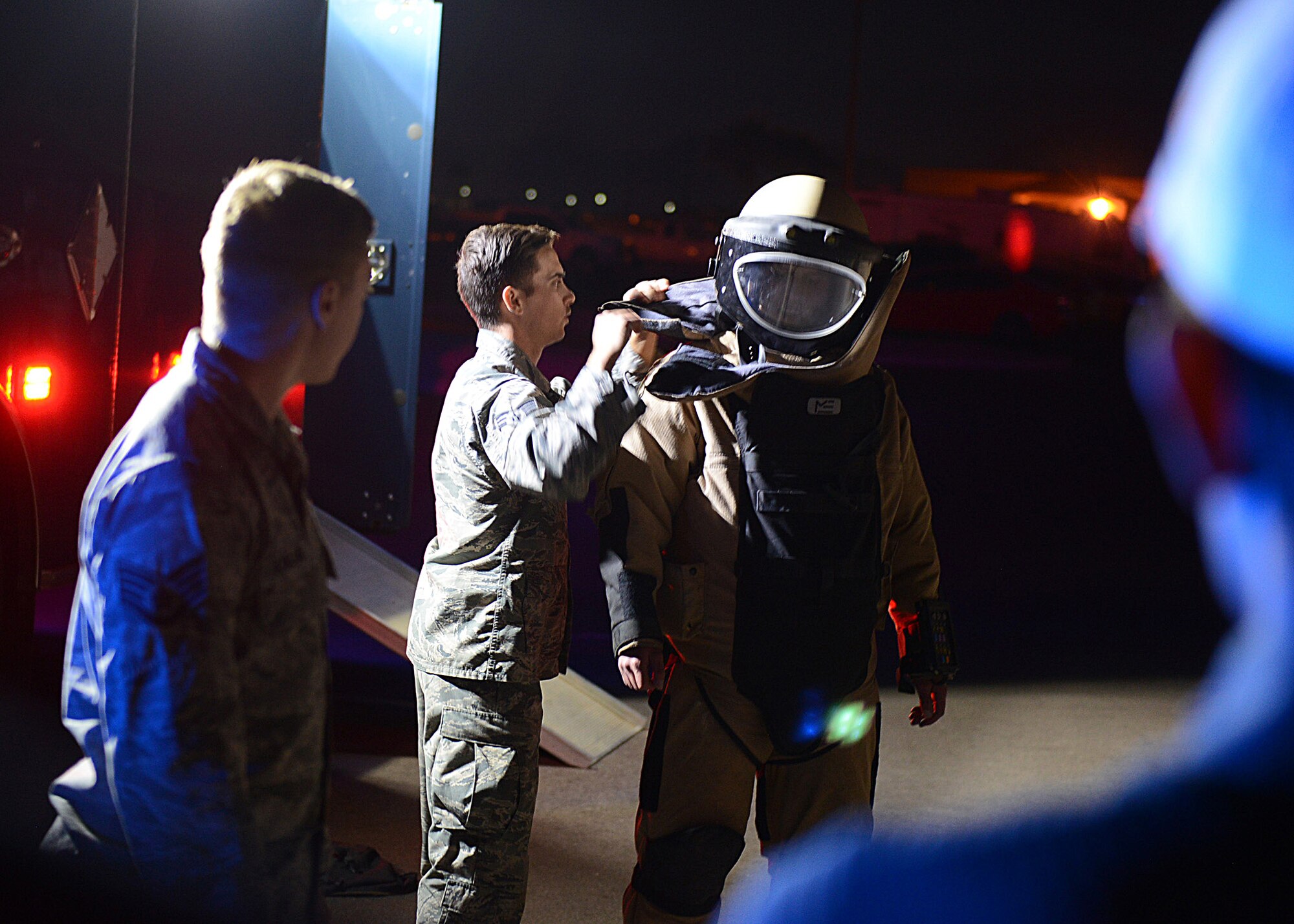 An All American Golf Tournament player finishes getting suited up by the 56th Civil Engineer Squadron explosive ordnance disposal technician during a tour at Luke Air Force Base, Ariz., Dec 27, 2017. The players were able to see how much weight the EOD personnel have to handle for their protection on their job. (U.S. Air Force photo by Senior Airman James Hensley)
