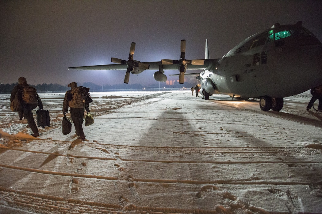 U.S. Air Force Reserve Airmen with the 514th Aeromedical Evacuation Squadron from Joint Base McGuire-Dix-Lakenhurst, New Jersey, board a C-130H Hercules prior to an aeromedical evacuation training mission, Dec. 15, 2017. (U.S. Air Force photo by Master Sgt. Mark C. Olsen)
