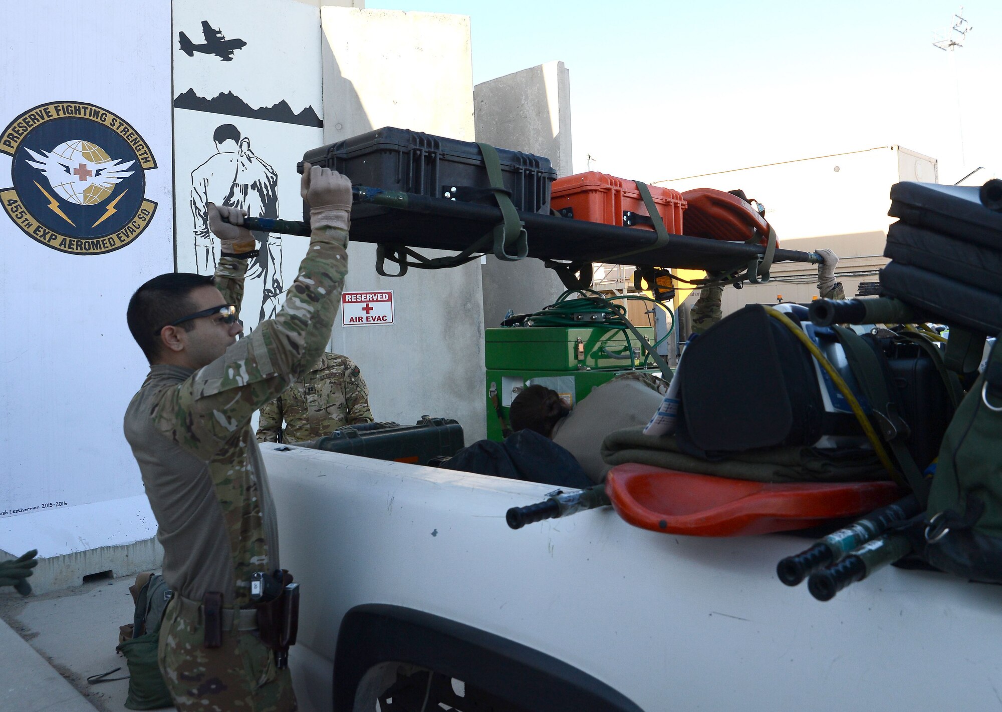 Airmen from the 455th Expeditionary Aeromedical Evacuation Squadron load medical equipment onto a truck Dec. 29, 2017 at Bagram Airfield, Afghanistan.