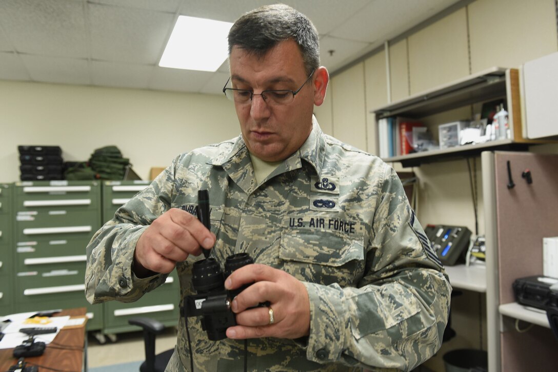 Master Sgt. Delbert Brumbaugh, an aircrew flight equipment journeyman with the Kentucky Air Guard’s 123rd Operations Support Squadron in Louisville, Ky., cleans the lenses of night-vision goggles in preparation for aircrew use June 9, 2017. Regular maintenance and inspection of life-saving equipment is the mission of the aircrew flight equipment shop.