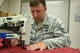 After identifying a weak area on an aircraft seat harness, Tech. Sgt. Lawrence Lawfer, an aircrew flight equipment journeyman with the Kentucky Air Guard’s 123rd Operations Support Squadron in Louisville, Ky., uses an industrial sewing machine to repair it June 9, 2017. Members of the aircrew flight equipment shop here are skilled in many different repair techniques