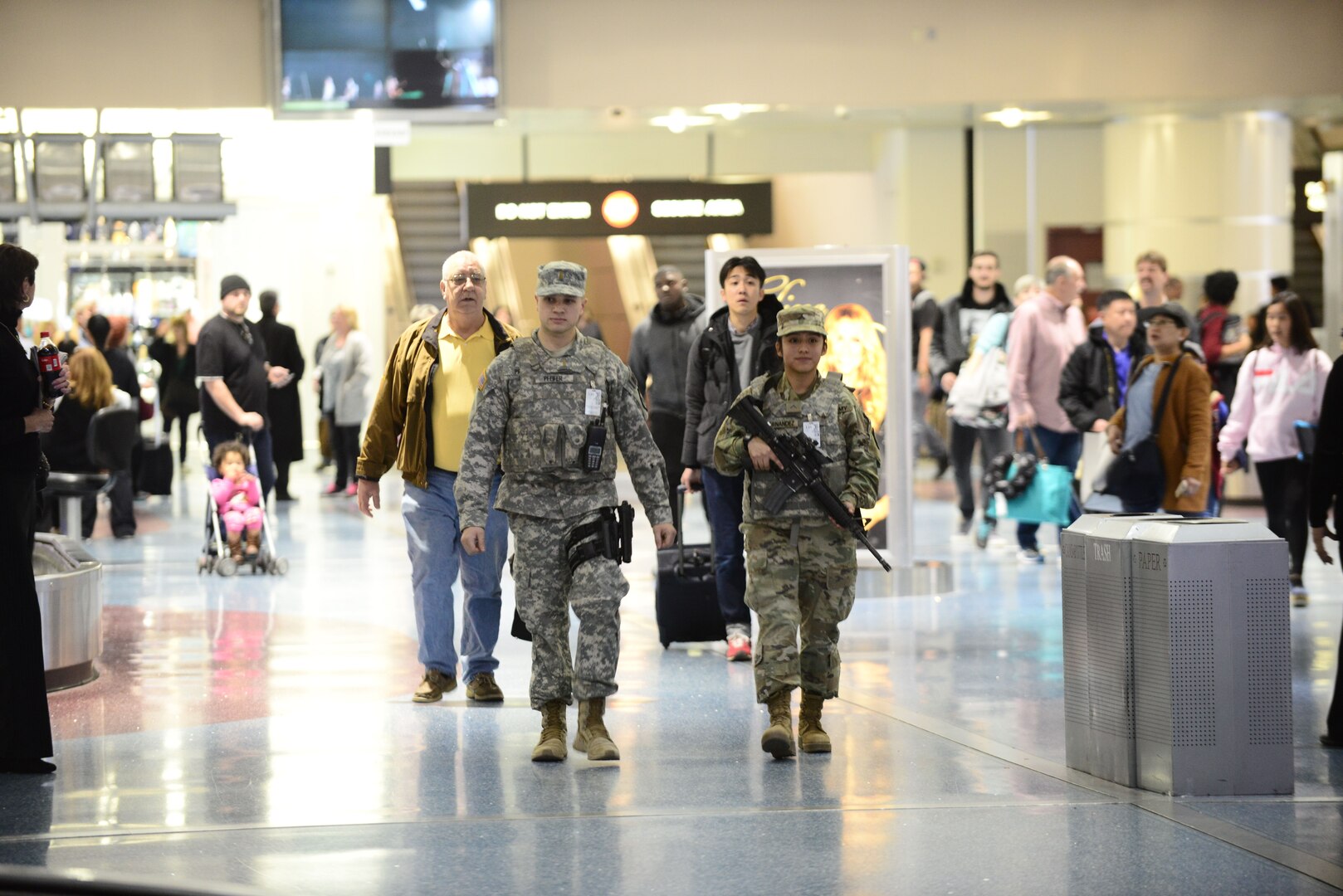 Two Nevada National Guard Soldiers conduct a foot patrol through the McCarran International Airport baggage claim in Las Vegas, Nevada.