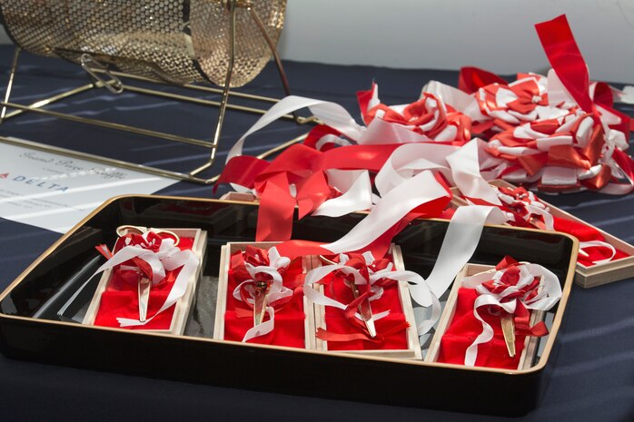 The ribbon-cutting scissors sit on a table during the United Service Organization Iwakuni grand opening at Marine Corps Air Station Iwakuni, Japan, Jan. 31, 2017. A ribbon-cutting ceremony was held to signify the official opening. Sponsors and guests toured the facility after the ceremony while enjoying complimentary snacks and refreshments. (U.S. Marine Corps photo by Lance Cpl. Gabriela Garcia-Herrera