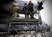 Tech. Sgt. Toron Bordain, 440th Air Expeditionary Advisory Squadron, C-130 maintenance advisor, works with his Afghan Air Force counterparts to remove an engine panel for training at Kabul Air Wing, Afghanistan, Jan. 18, 2017. Bordain, an Air Force Reservist out of Dobbins Air Reserve Base, Ga., is part Train, Advise, Assist Command-Air (TAAC-Air), working to develop a professional, capable and sustainable Afghan Air Force. (U.S. Air Force photo by Tech. Sgt. Veronica Pierce) 