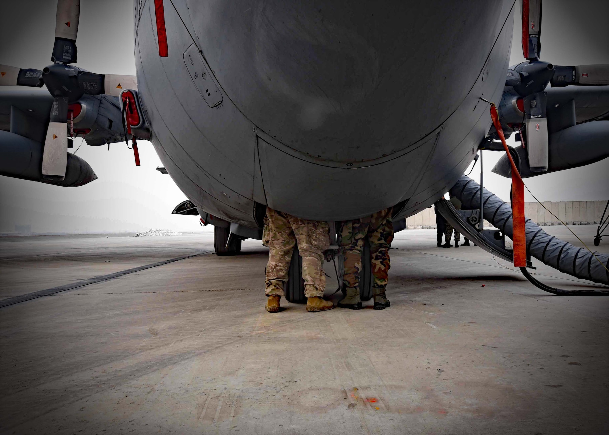 A C-130H maintenance advisor from Train, Advise, Assist Command-Air (TAAC-Air), 440th Air Expeditionary Advisory Squadron, trains an Afghan Air Force C-130 maintainer on the aircraft hydraulics  system at Kabul Air Wing, Afghanistan, Jan. 18, 2017. On Jan. 11, 2017, a group of 44 AAF C-130H maintainers were the first in-country trained to graduate and receive their level three certification.  
The recent graduates were trained by Total Force Airmen who specialize in various maintenance Air Force Specialty Codes from; engine and propulsion, hydraulics, fuel, electrical and environmental, avionics, and crew chief specialist. (U.S. Air Force photo by Tech. Sgt. Veronica Pierce) 
