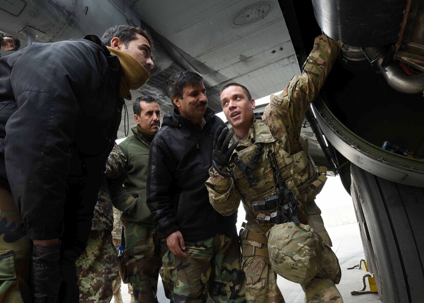 Tech. Sgt. Brian Evancho, 440th Air Expeditionary Advisory Squadron, C-130 maintenance advisor, a reservist assigned to Youngstown Air Reserve Station, Ohio, reviews training with Afghan Air Force counterparts at Kabul Air Wing, Afghanistan, Jan. 18, 2017. On Jan. 11, 2017, a group of 44 AAF C-130H maintainers were the first in-country trained to graduate and receive their level three certification. The maintenance graduates were trained locally by Total Force Airmen assigned to Youngstown ARS, Ohio, and Dobbins Air Reserve Base, Ga. (U.S. Air Force photo by Tech. Sgt. Veronica Pierce)