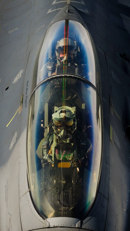 An F-16 Fighting Falcon pilot and crew member from Aviano Air Base, Italy, wait while their F-16 receives fuel from a KC-135 Stratotanker, assigned to the Arizona Air National Guard’s 161st Air Refueling Wing, Jan. 27, 2017, at Souda Bay, Greece. The KC-135 refueled U.S. and Hellenic air force F-16s during the FTD, which was hosted to evaluate aircraft and personnel capabilities and increase interoperability between the two NATO allies. (U.S. Air Force photo by Staff Sgt. Austin Harvill)