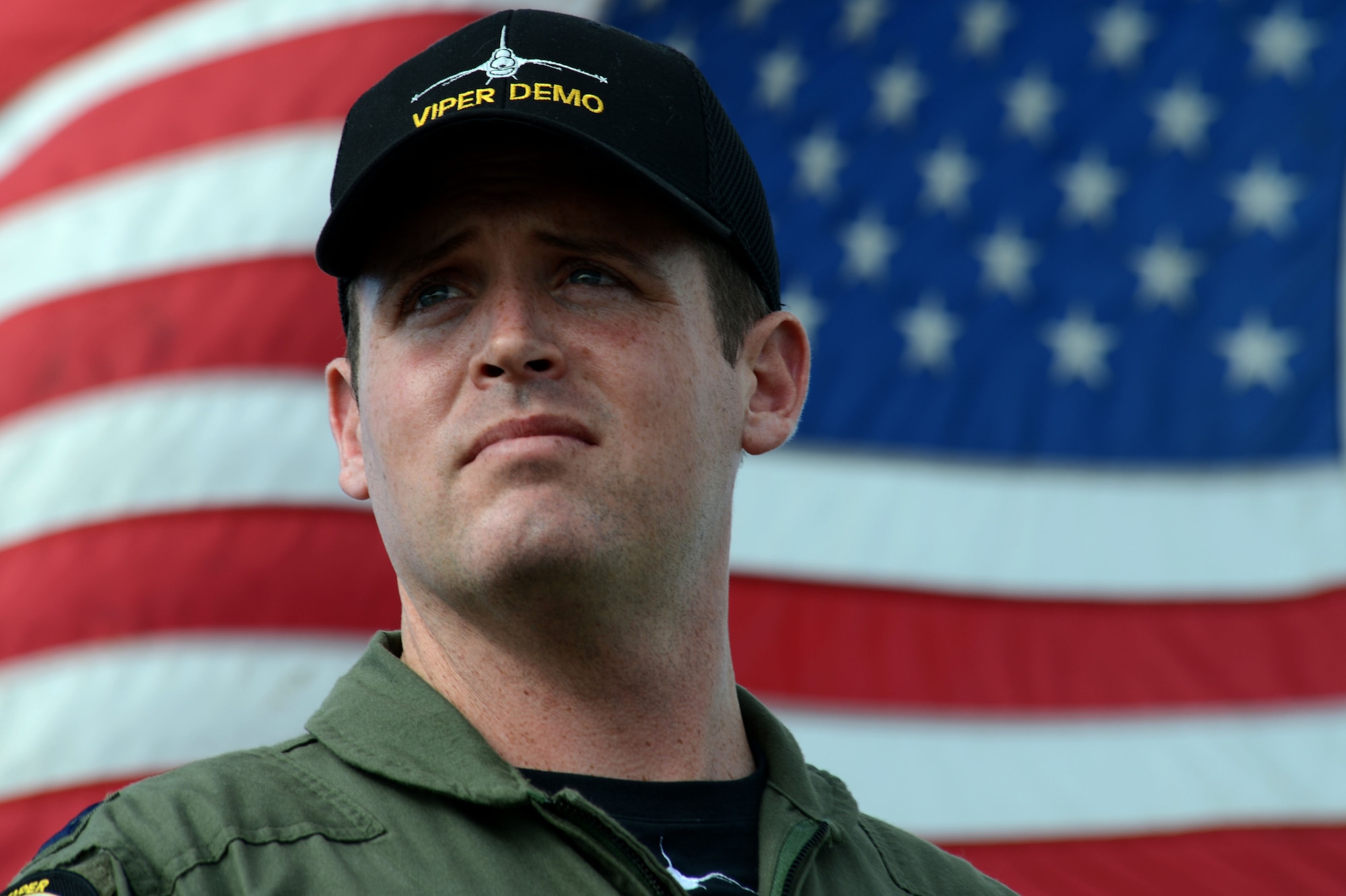 U.S. Air Force Capt. John Waters, F-16 Viper Demonstration Team pilot, looks over the flightline during the Stuart Airshow in Stuart, Fla., Nov. 8, 2016. Waters is a veteran pilot with more than 2,500 hours in a military aircraft and 180 combat missions in support of Operation Iraqi Freedom and Inherent Resolve. (U.S. Air Force photo by Senior Airman Michael Cossaboom)