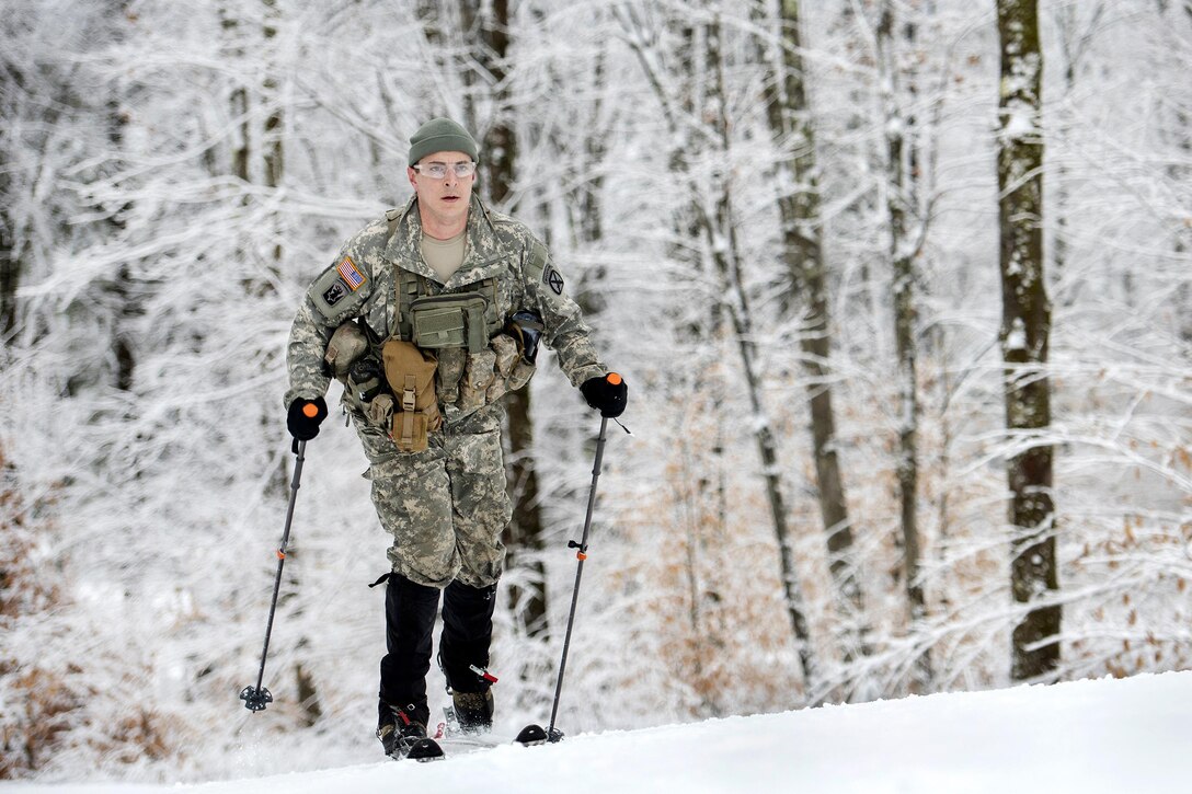 Army National Guard Staff Sgt. Robin Fitch-McCullough maneuvers on skis before participating in marksmanship training at the Camp Ethan Allen Training Site, Jericho, Vt., Jan. 25, 2017. Fitch-McCullough is an infantryman assigned to the Vermont Army National Guard’s Company A, 3rd Battalion, 172nd Infantry Regiment, 86th Infantry Brigade Combat Team (Mountain). Air National Guard photo by Tech. Sgt. Sarah Mattison