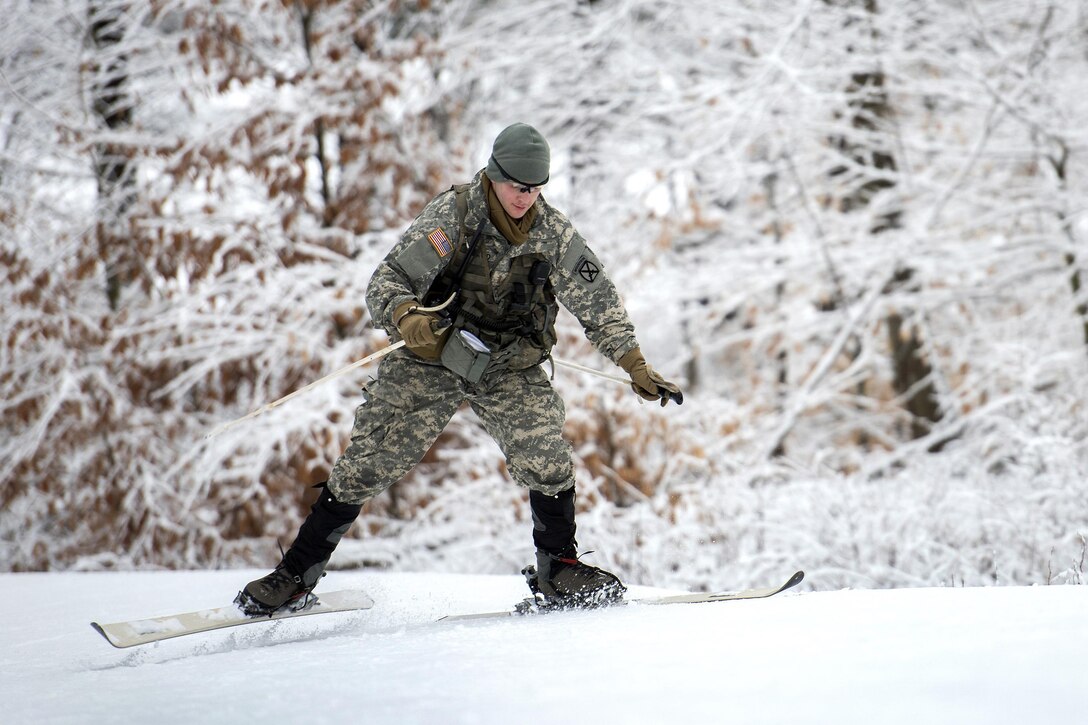 An Army National Guard soldier attempts to keep his balance on skis before participating in marksmanship training at the Camp Ethan Allen Training Site, Jericho, Vt., Jan. 25, 2017. Air National Guard photo by Tech. Sgt. Sarah Mattison
