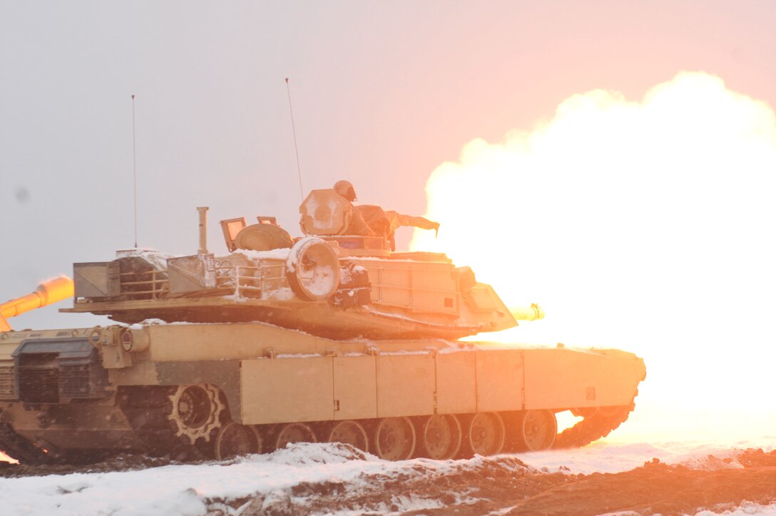 An Army M1A2 Abrams tank fires a round during the first live-fire accuracy screening tests at Presidential Range in Swietozow, Poland, Jan. 16, 2017. The tank and crew are assigned to the 4th Infantry Division’s 1st Battalion, 68th Armor Regiment, 3rd Armored Brigade Combat Team. Army photo by Staff Sgt. Elizabeth Tarr