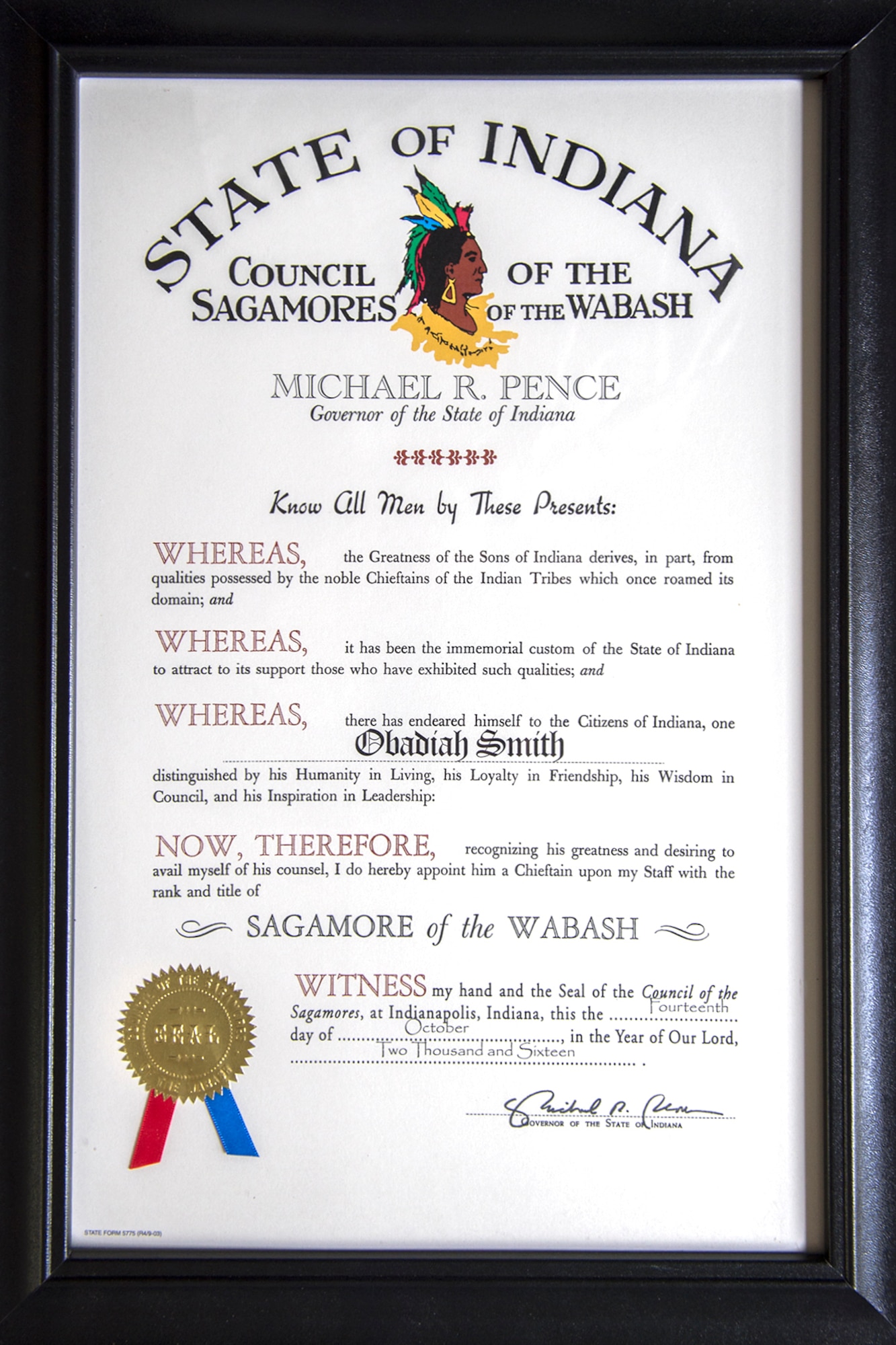 Chaplain (Lt. Col.) Obadiah Smith, Jr., 434th Air Refueling Wing chaplain, received The Sagamore of the Wabash Award, on behalf of former Indiana Gov. Mike Pence during a Commander’s Call at Grissom Air Reserve Base, Ind., Jan. 7, 2016.  The award is a personal tribute given to those who have rendered a distinguished service to Indiana or the governor. (U.S. Air Force photo/Tech. Sgt. Benjamin Mota)