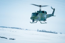 A UH-1N Iroquois from the 54th Helicopter Squadron flies over Minot Air Force Base’s missile complex, N.D., Jan. 25, 2017. The purpose of the flight was to perform training maneuvers and complete a security sweep of 91st Missile Wing launch facilities.  The 54th HS’s fleet is critical in providing support to 91st MW Airmen and assets in the missile complex. (U.S. Air Force photo/Airman 1st Class J.T. Armstrong)