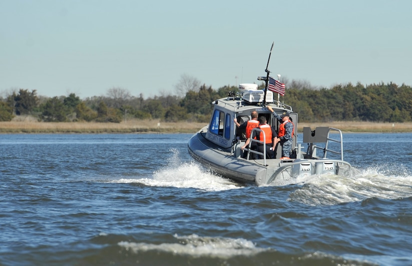 Hanahan police officers tour the Cooper River on a 628th Security Forces Squadron patrol boat Jan. 25. As part of the tour, a new memorandum of understanding was ratified dictating jurisdictional and coordinated response between the base and the neighboring community. The relationship supplements both Joint Base Charleston and Hanahan by opening up communication opportunities not previously available to their department.