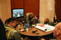 Command staff with Chemical Biological Incident Response Force, CBIRF, U.S. Marine Corps Forces Command, monitor the 58th Presidential Inauguration in a tactical command post, Jan. 20, 2017. Initial Response Force A, CBIRF, assumed the ready position working under Joint Task Force National Capitol Region, JTF-NCR, which provided military support to the lead agency the U.S. Secret Service during the 58th Presidential Inauguration in Washington D.C., Jan. 20, 2017. The Inauguration was designated a National Special Security Event, NSSE, by the Secretary of the Department of Homeland Security on July 2016. When an event is designated an NSSE, the U.S. Secret Service assumes its mandated role as the lead federal agency for the design and implementation of the operational security plan. Although elements of CBIRF were staged near the U.S. Capitol building, other elements of CBIRF were on standby at CBIRF headquarters, making the Inauguration supported by the entire CBIRF unit. (Official USMC Photos by Staff Sgt. Santiago G. Colon Jr./RELEASED)
