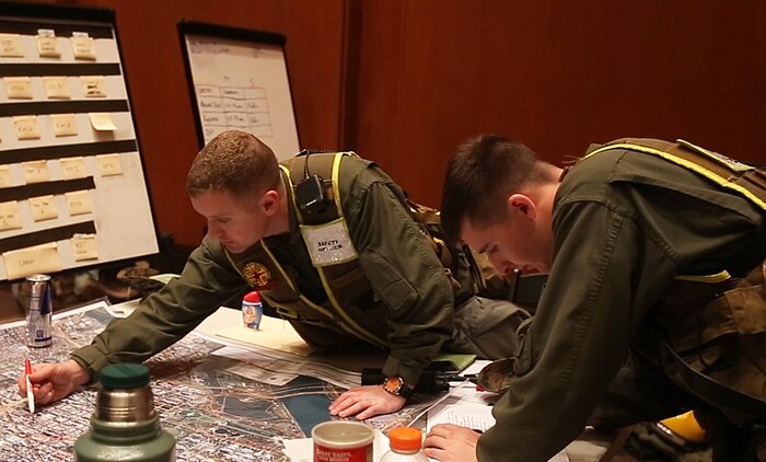 Command staff with Chemical Biological Incident Response Force, CBIRF, U.S. Marine Corps Forces Command, monitor the 58th Presidential Inauguration in a tactical command post, Jan. 20, 2017. Initial Response Force A, CBIRF, assumed the ready position working under Joint Task Force National Capitol Region, JTF-NCR, which provided military support to the lead agency the U.S. Secret Service during the 58th Presidential Inauguration in Washington D.C., Jan. 20, 2017. The Inauguration was designated a National Special Security Event, NSSE, by the Secretary of the Department of Homeland Security on July 2016. When an event is designated an NSSE, the U.S. Secret Service assumes its mandated role as the lead federal agency for the design and implementation of the operational security plan. Although elements of CBIRF were staged near the U.S. Capitol building, other elements of CBIRF were on standby at CBIRF headquarters, making the Inauguration supported by the entire CBIRF unit. (Official USMC Photos by Staff Sgt. Santiago G. Colon Jr./RELEASED)
