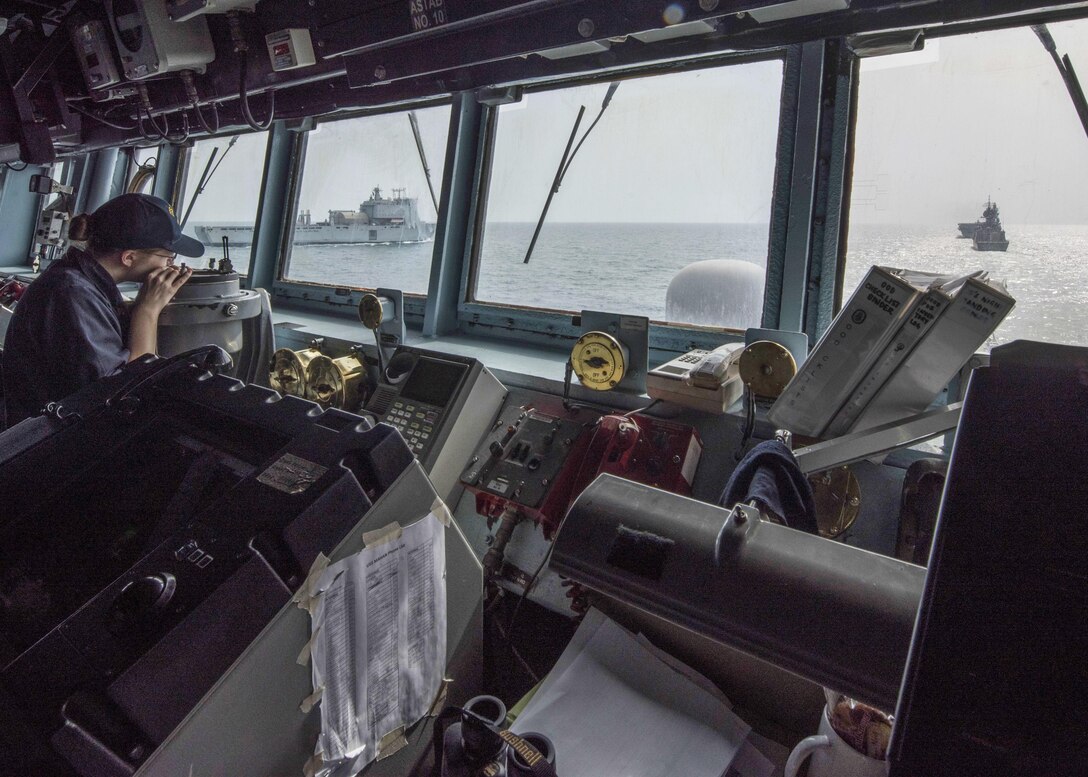 170201-N-CS953-011

ARABIAN SEA (Feb. 1, 2016) Lt. j.g. Collie Wood checks bearings as the Arleigh Burke-class guided-missile destroyer USS Mahan (DDG 72) stays in a close formation with vessel from three other nations during Exercise Unified Trident 2017. Unified Trident is a multilateral maritime exercise with the U.S. Navy, Royal Navy, Australian Royal Navy and French Marine Nationale to be a enhance mutual capabilities improve tactical proficiency and strengthen partnerships in ensuring the free flow of commerce and freedom of navigation within the 5th Fleet area of operation. (U.S. Navy photo by Mass Communication Specialist 1st Class Tim Comerford)