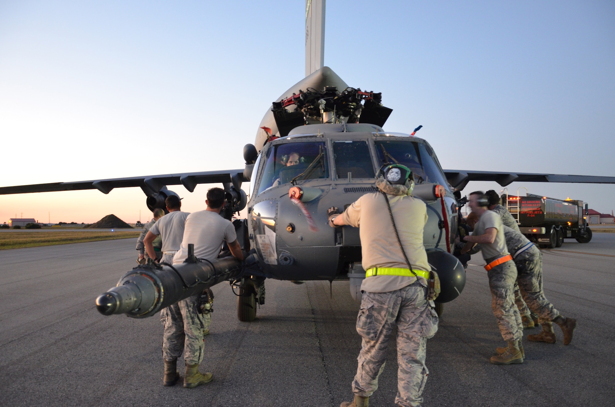 To ensure the flying safety of Air Force choppers used to save lives in combat, maintenance crews from the 920th Rescue Wing swap out an HH-60G Pave Hawk helicopter for reconditioning January 25, 2017. A team of 10 maintainers is necessary to skillfully muscle the metal warrior into the cargo bay however, more often join the unique event for hands-on training and to secure the warrior on a smooth journey over an ocean and a continent to trade places with the combat-weary aircraft. (U.S. Air Force photo/Maj. Cathleen Snow)
