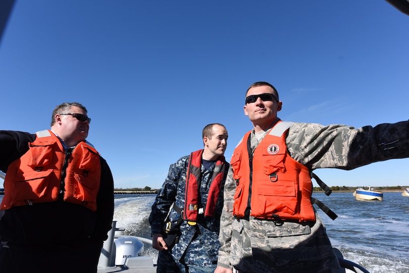 Lt. Col. Robert Clouse, right, 628th Security Forces Squadron commander, and Chief Master at Arms Joseph Blacka accompany Joseph Bowers, left, Hanahan fire chief, on a security forces patrol boat tour of the Cooper River Jan 25. The boat tour was an opportunity to show Hanahan city officials the capabilities of Joint Base Charleston’s security forces. Additionally, as part of the tour, a new memorandum of understanding was ratified dictating jurisdictional and coordinated response between the base and the neighboring community.