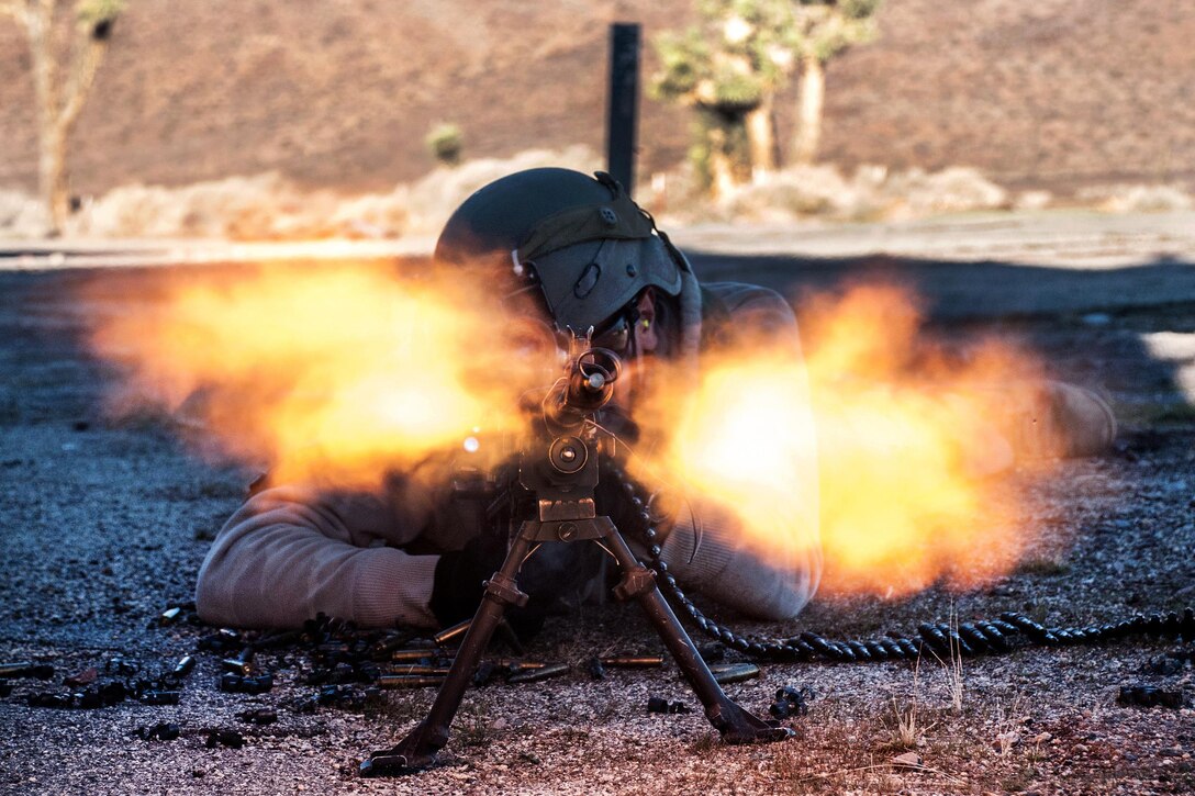 A soldier fires his M240-B machine gun during air assault training conducted near the Fuldez Ground Control Center at the National Training Center at Fort Irwin, Calif., Jan. 25, 2017. The soldier is an infantryman assigned to the 1st Squadron, 11th Armored Cavalry Regiment. The training demonstrated the troop’s ability to carry out complex missions while enhancing the unit’s ability of employing aviation resources. Army photo by Sgt. David Edge