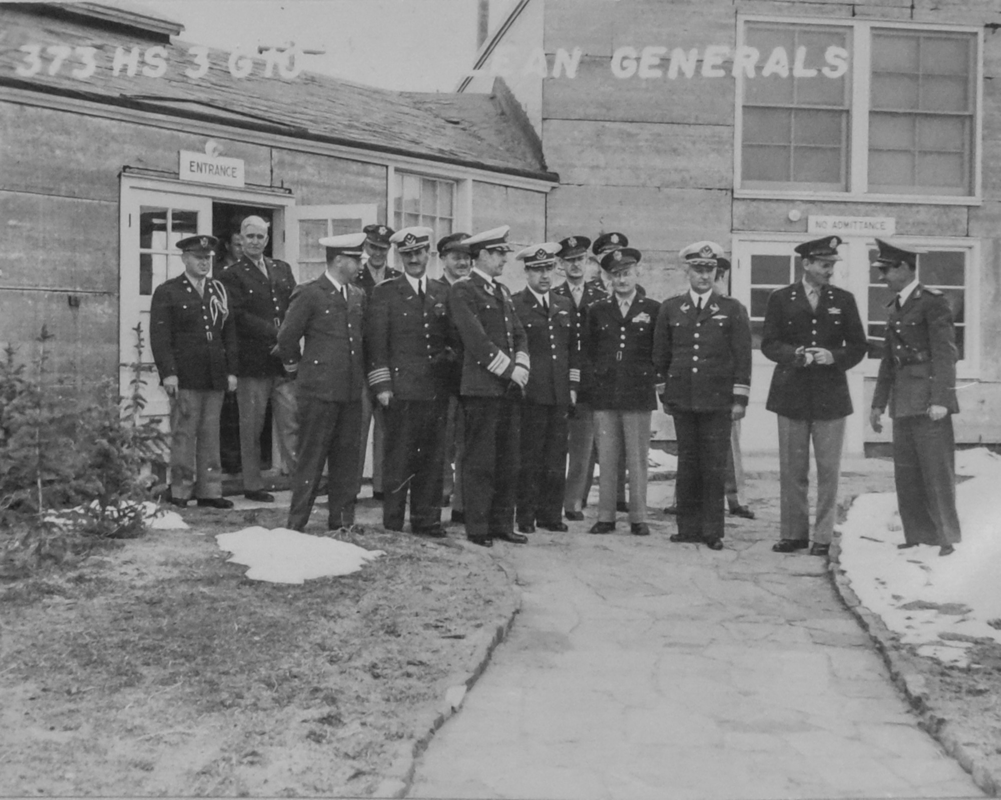 PETERSON AIR FORCE BASE, Colo. – Officers from Uruguay, Chile, and the United States, leave building 880. Seen here uncovered is Major A.B. Williams, then the commander of the 6th Photographic Squadron. (Courtesy photo from Peterson Air and Space Museum)