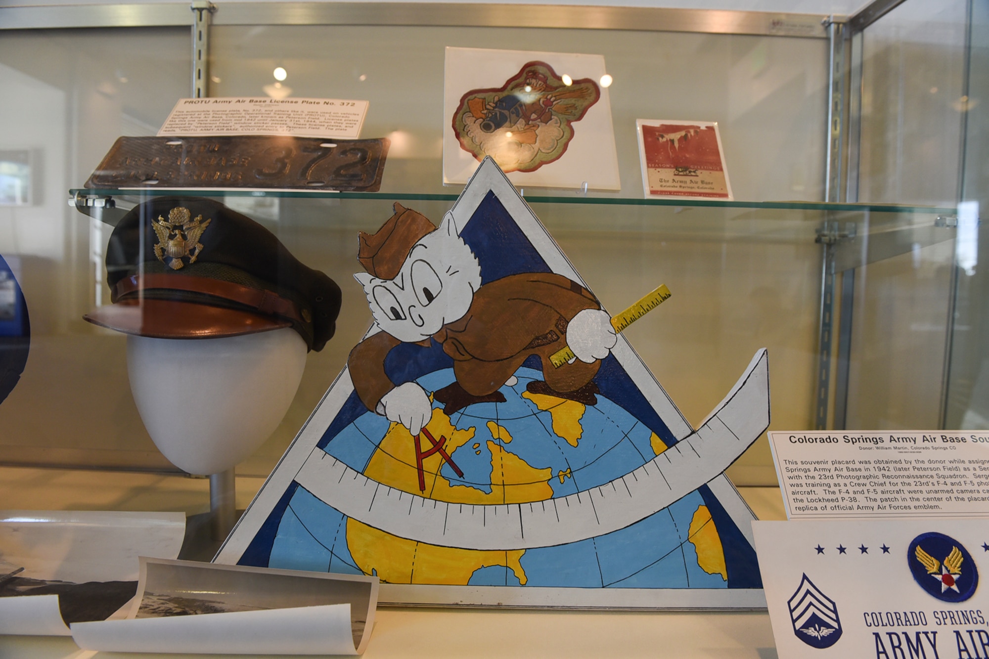 PETERSON AIR FORCE BASE, Colo. – The emblem of the 6th Photographic Squadron sits in a display case at the Peterson Air and Space Museum, Jan. 26, 2017. Nicky the Owl was the mascot for the squadron and is shown here standing on top of the globe. (U.S. Air Force photo by Philip Carter)