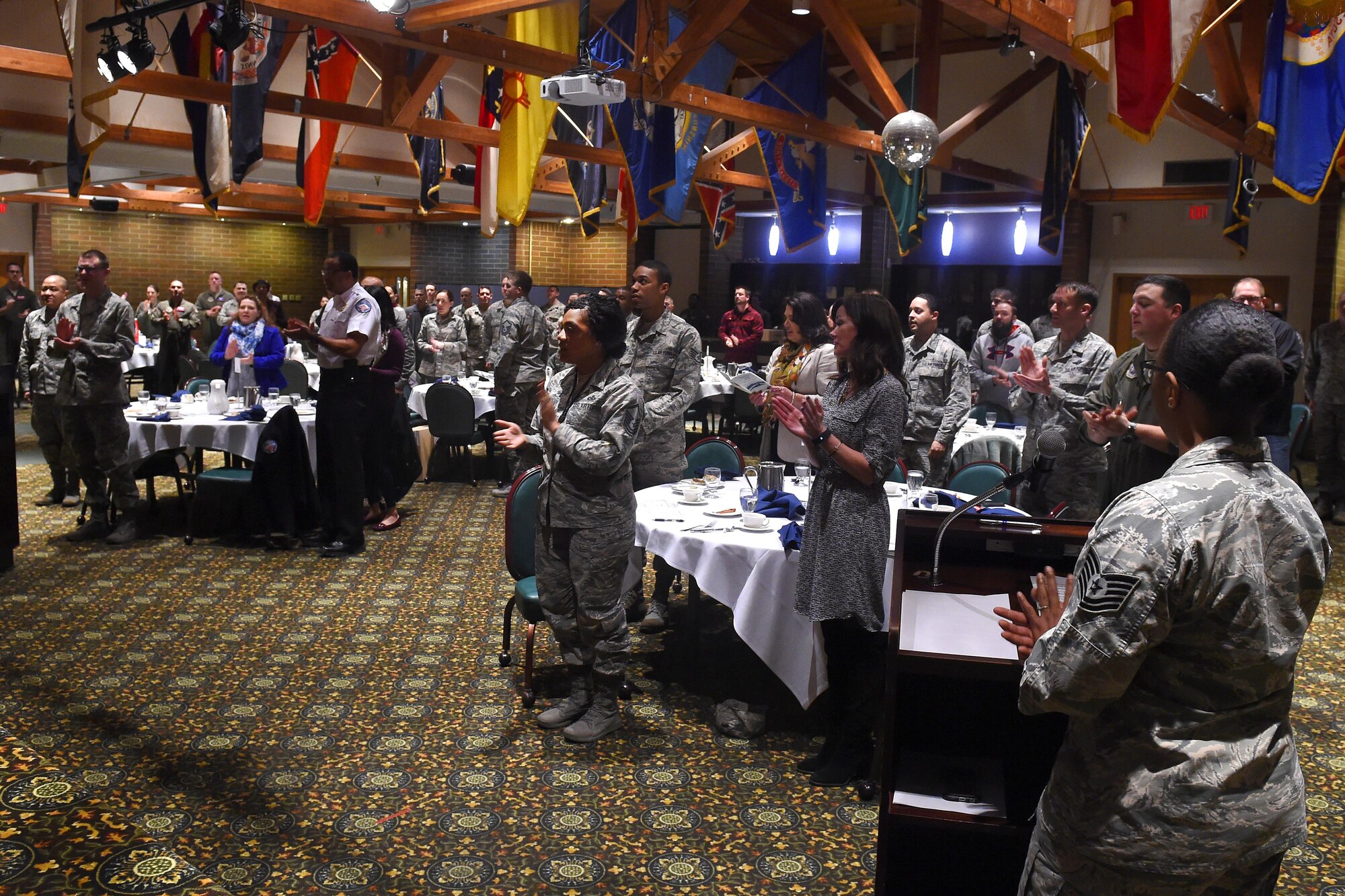 Members of Team McChord applaude the 2016 62nd Airlift Wing Annual Award winners Jan. 27, 2017 at Joint Base Lewis McChord, Wash. All award nominnes were recognized during the 2016 62nd Airlift Wing Annual Award breakfast. (U.S. Air Force photo/Tech. Sgt. Timothy Chacon)