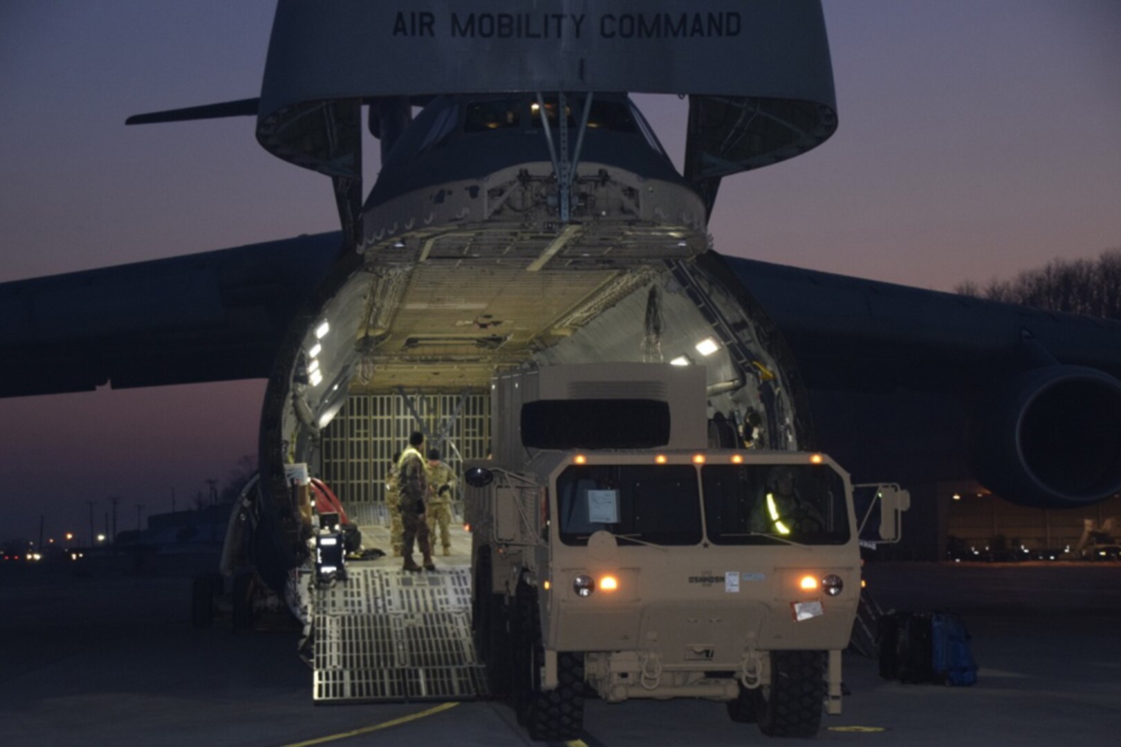 A heavy expanded mobility tactical truck pulls an electrical power plant system from the belly of a C-5 Super Galaxy at Osan Air Base, Jan. 26, 2017.  The addition of the inbound Patriot equipment will support 35th ADA Brigade as it conducts the largest Patriot modernization effort ever executed outside a depot facility.