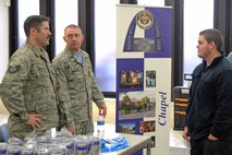 Members of the chapel dicuss services offered by the chapl to a veteran on Jan. 27 at the Veteran Resource Fair.The chapel offers Pastoral care, counceling, worships services and religious education. (U.S. Air Force photo by Airman Chad Gorecki)