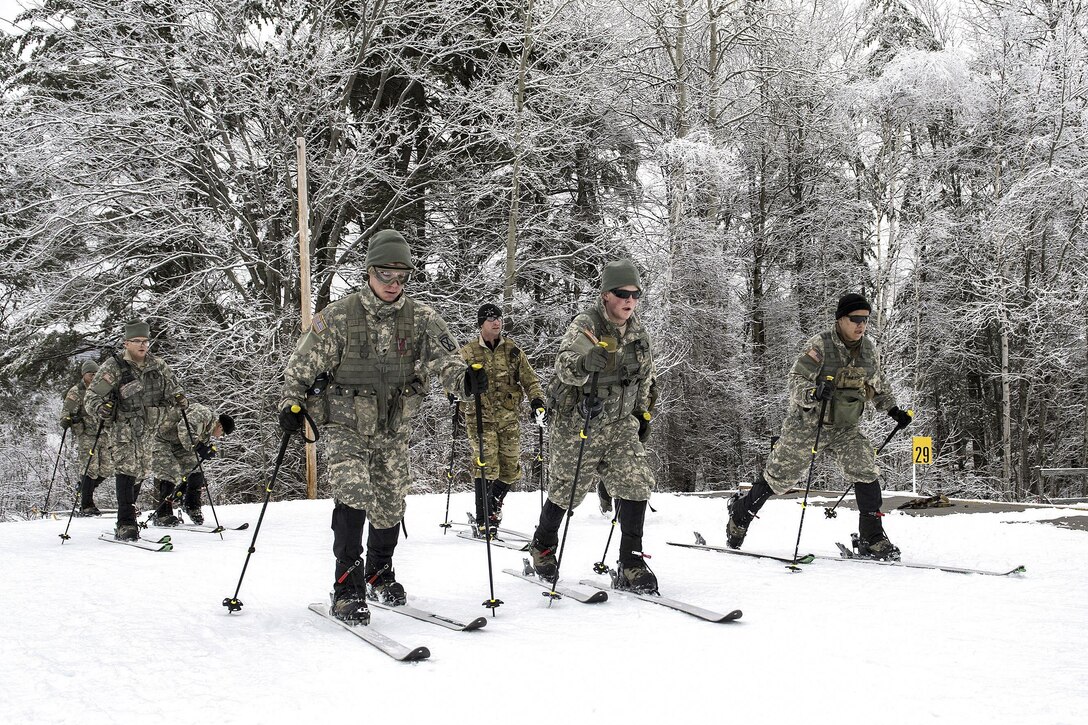 Soldiers maneuver on skis before participating in a stress shoot at Camp Ethan Allen Training Site in Jericho, Vt., Jan. 25, 2017. The soldiers are assigned to the Army National Guard. Air National Guard photo by Tech. Sgt. Sarah Mattison