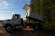 U.S. Air Force Senior Airman Joshua Minton, 20th Civil Engineer Squadron pavement and construction equipment apprentice, backs up a dump truck at Shaw Air Force Base, S.C., Feb. 1, 2017. The dump trucks used by 20th CES can hold up to 10 tons and are used to bring material to and from construction sites. (U.S. Air Force photo by Airman 1st Class BrieAnna Stillman)