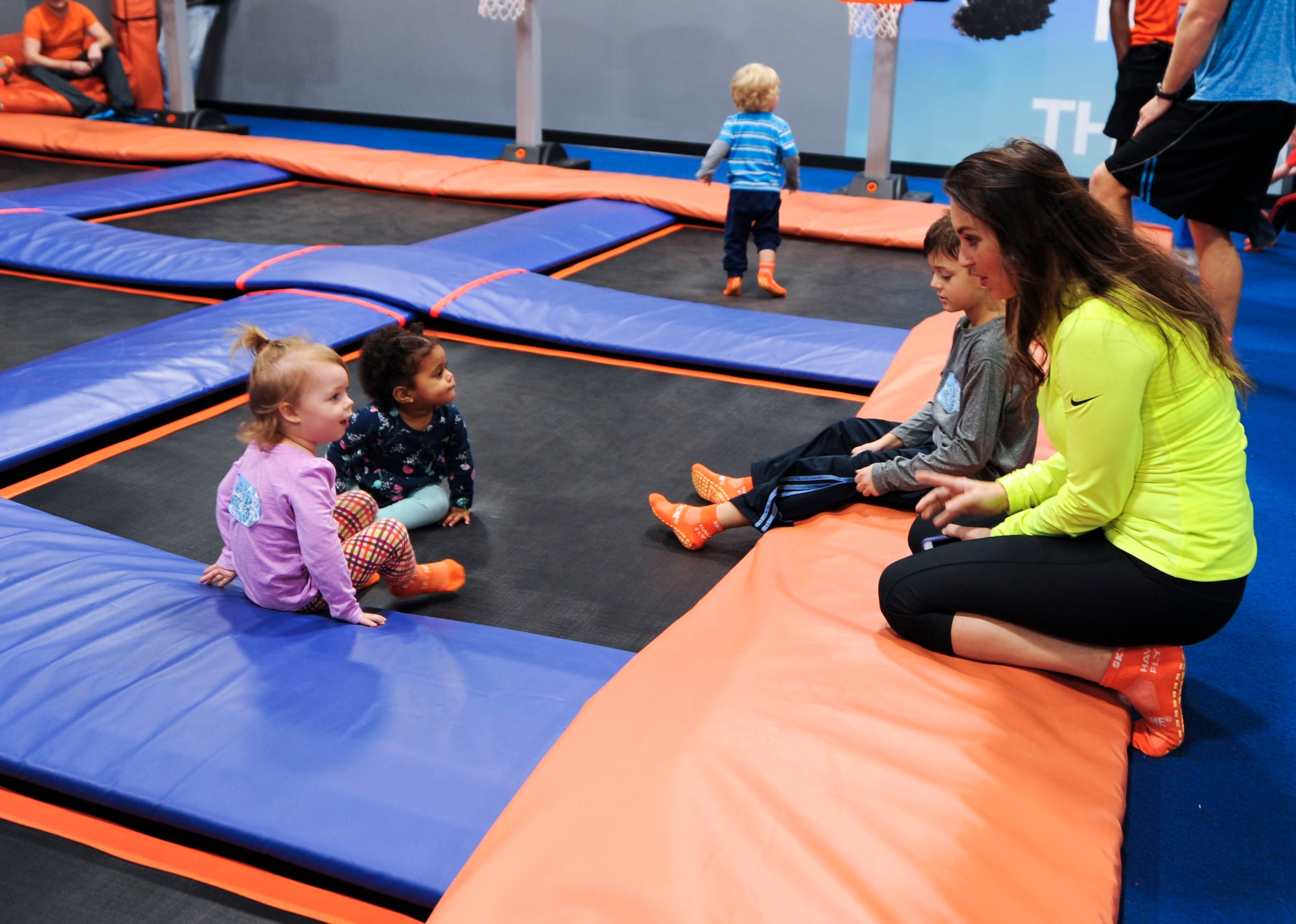 Elizabeth Clark, a community readiness specialist with the Hurlburt Field Airman and Family Readiness Center, engages with children during a Hearts Apart event at the Sky Zone in Pensacola, Fla., Jan. 28, 2017. The Hurlburt Airman and Family Readiness Center hosts monthly events and offers support opportunities for families of deployed Air Commandos. (U.S. Air Force photo by Senior Airman Kasie P. Whitfield)