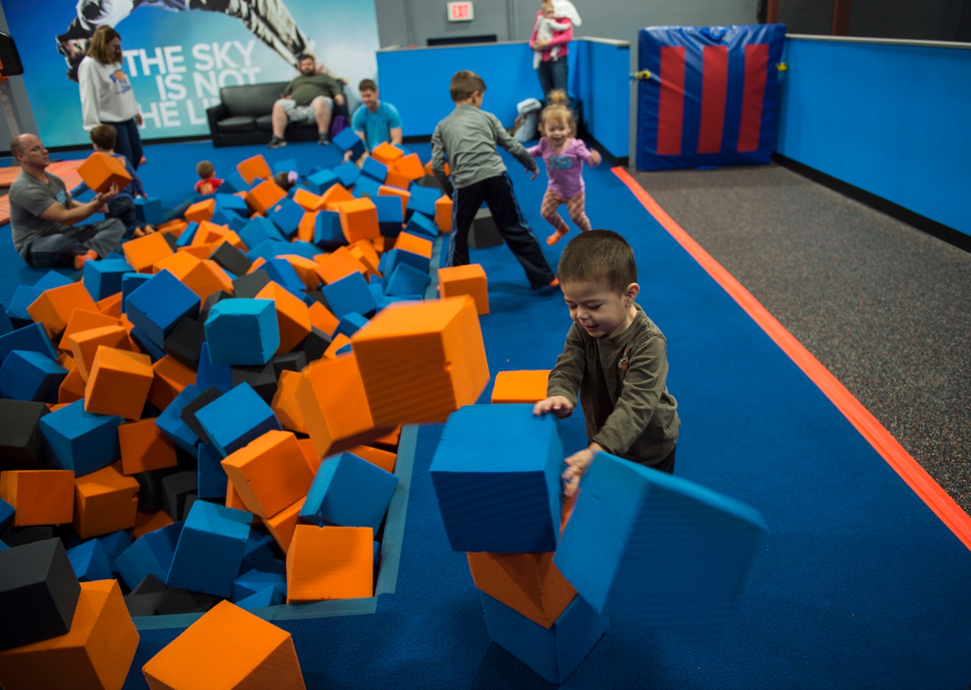 Nomar Tash, son of Master Sgt. Corey Tash, an AC-130U specialist section chief with the 1st Special Operations Maintenance Squadron, plays with blocks during a Hearts Apart event at the Sky Zone in Pensacola, Fla., Jan. 28, 2017. Hearts Apart activities focus on deployment support for Air Commandos and their families prior to the deployment and throughout. (U.S. Air Force photo by Senior Airman Krystal M. Garrett)