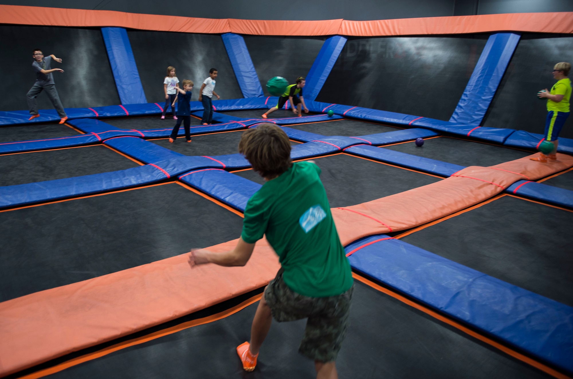 Families of deployed Air Commandos play dodgeball during a Heart Apart event at the Sky Zone in Pensacola, Fla., Jan. 28, 2017.  During the two-hour event, families had the opportunity to jump on the trampolines, eat pizza and connect with families going through similar experiences. (U.S. Air Force photo by Senior Airman Krystal M. Garrett)