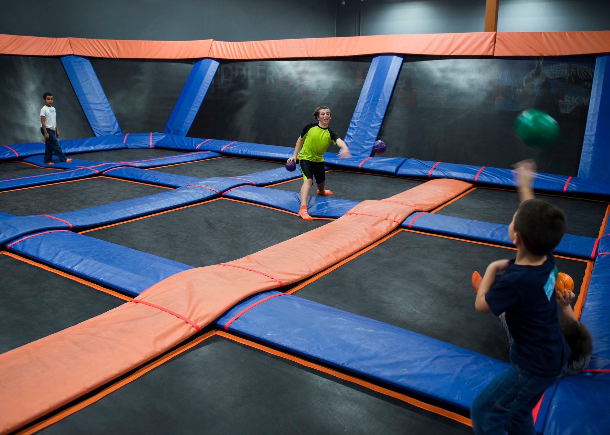 Families of deployed Air Commandos play dodgeball during a Hearts Apart event at the Sky Zone in Pensacola, Fla., Jan. 28, 2017. Hearts Apart is a program through the Hurlburt Field Airman and Family Readiness Center that connects spouses and loved ones of deployed Air Commandos to encourage support systems. (U.S. Air Force photo by Senior Airman Krystal M. Garrett)