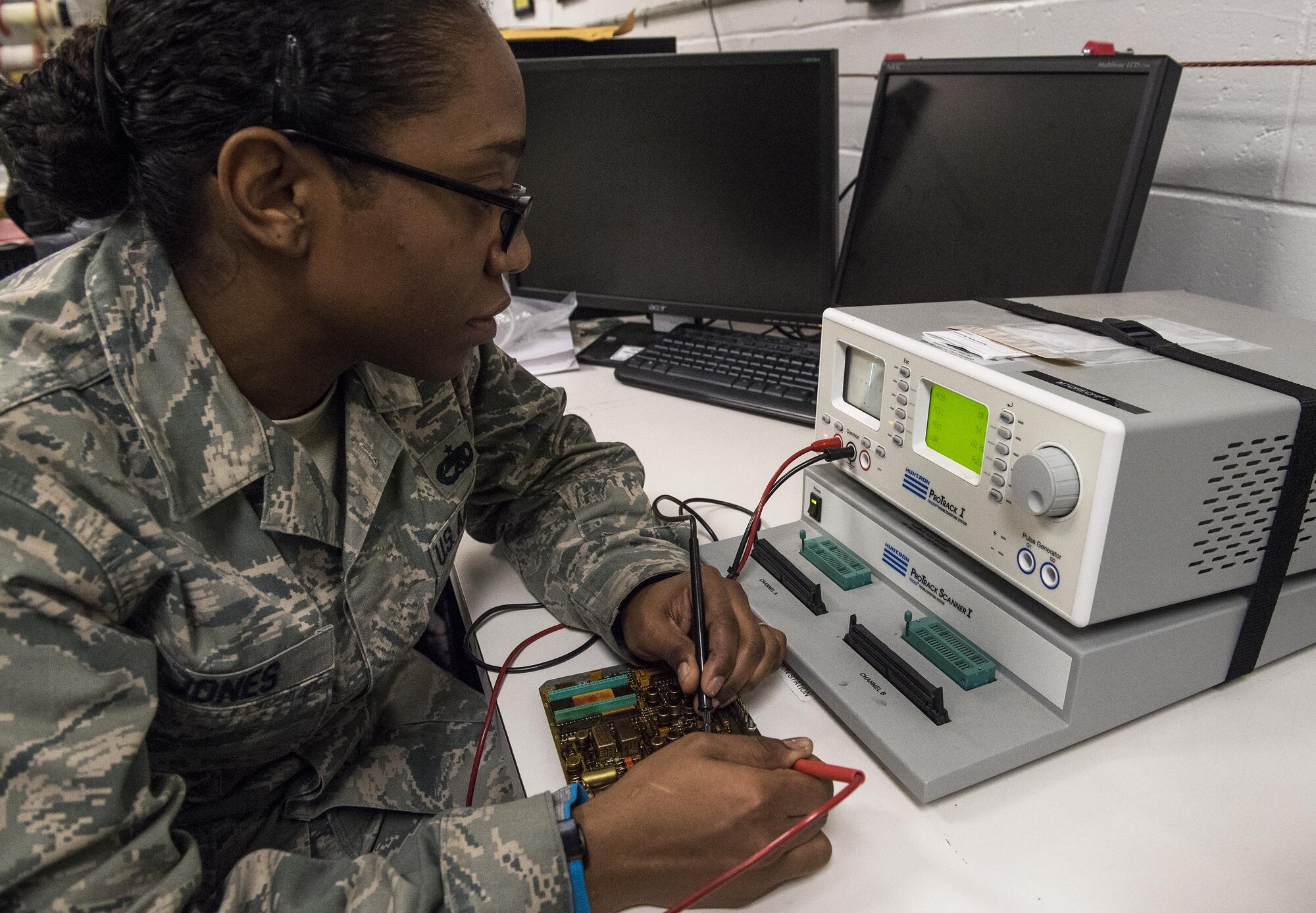 Staff Sgt. Alexandria Jones, 23d Maintenance Group Air Force Repair Enhancement Program Technician, uses a HUNTRON machine to check circuit board readings, Jan. 30, 2017, at Moody Air Force Base, Ga. The machine tests the signals that the diodes and resistors give off. Technicians then use a database to compare the circuit board’s current reading with readings of properly functioning boards so they can find and fix the problem efficiently. (U.S. Air Force photo by Airman 1st Class Janiqua P. Robinson)